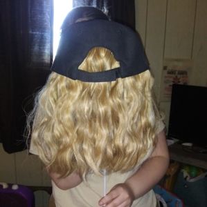 Blonde wavy wig attached to cap